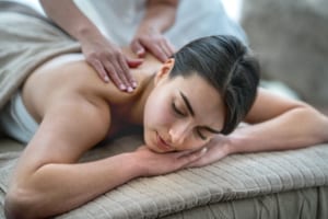 Beautiful woman getting a massage on her back at the spa - beauty concepts