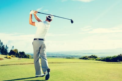 Physio and Pilates for Golfers - Golfer taking a swing