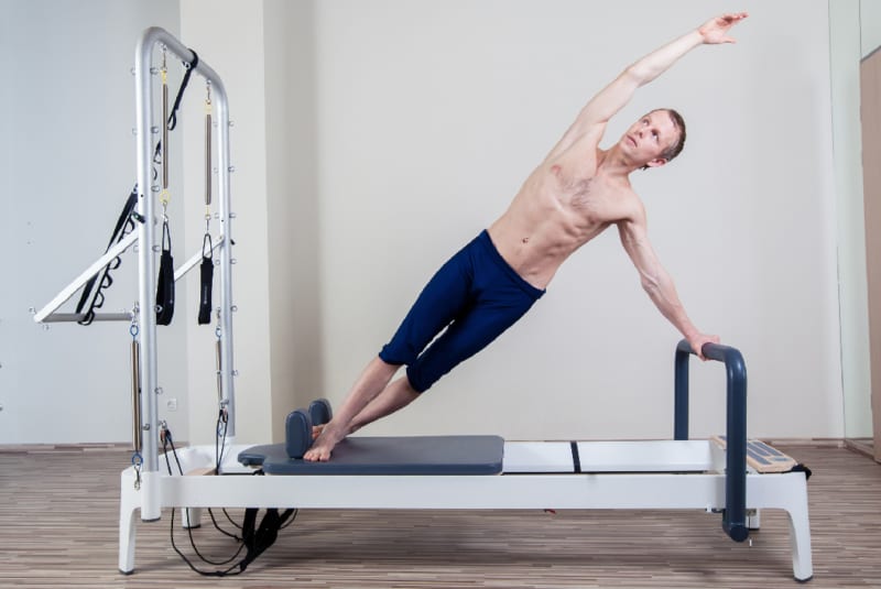 Physio and Pilates for Golfers - Man performing Pilates 